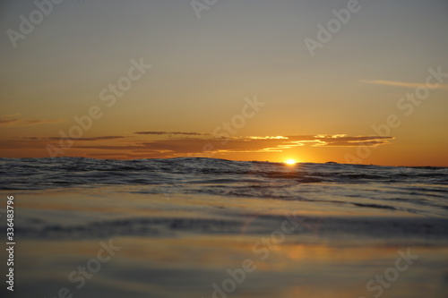 Sunset by the sea. Orange horizon during a relaxing sunset.