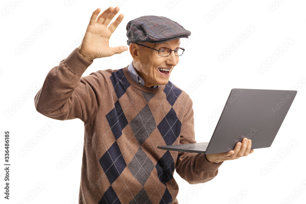 Elderly man waving and talking on a web camera on a laptop computer Elderly man waving and talking on a web camera on a laptop computer