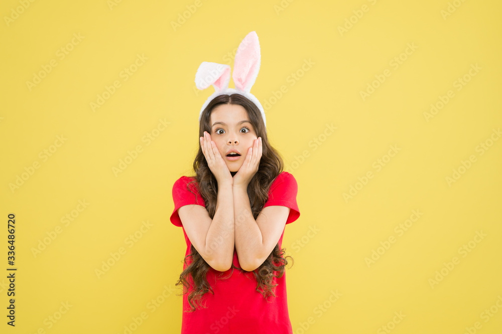 happy childhood. surprised kid celebrate easter holiday. spring holiday tradition. schoolgirl have fun. celebrate traditional feast. Easter bunny costume. funny little girl in rabbit ears