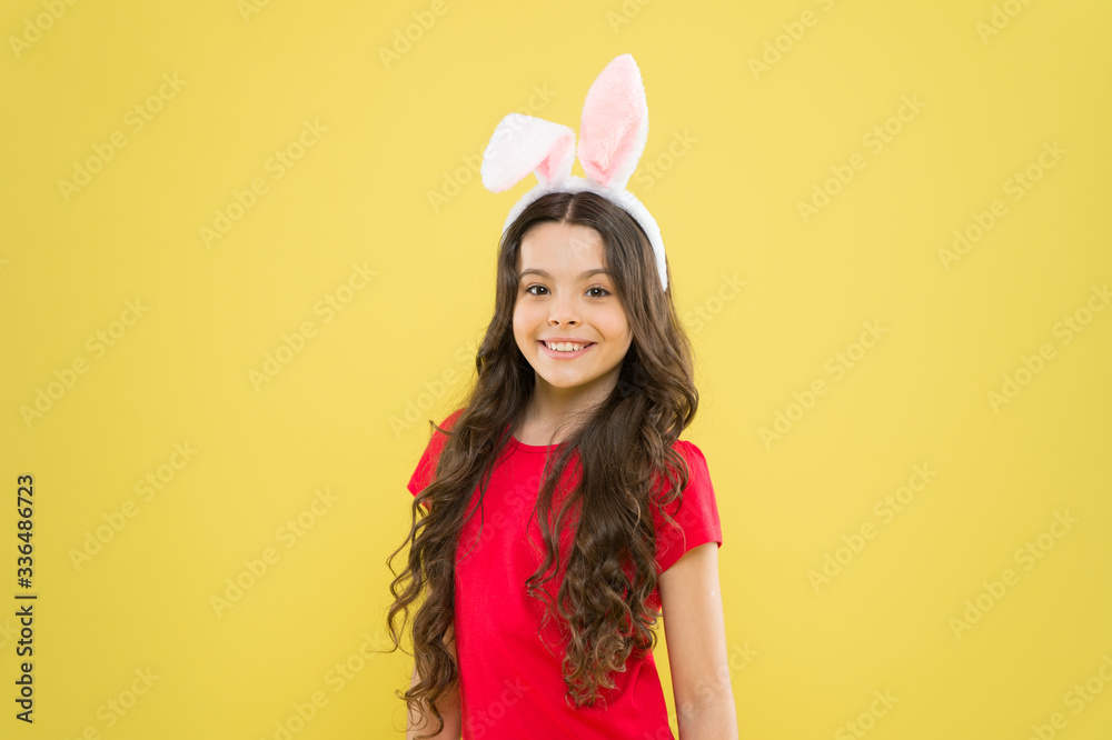 spring holiday tradition. schoolgirl have fun. celebrate traditional feast. Easter bunny costume. funny little girl in rabbit ears. happy childhood. Cheerful kid celebrate easter holiday