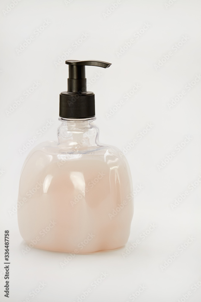 Liquid soap dispenser on light background. Hygiene to protection from Covid-19. Coronavirus prevention. Liquid soap dispenser on light background. Hygiene to protection from Covid-19. Coronavirus prevention.