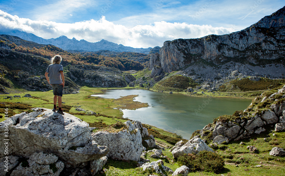 hiker looks at lakes of covadonga from above