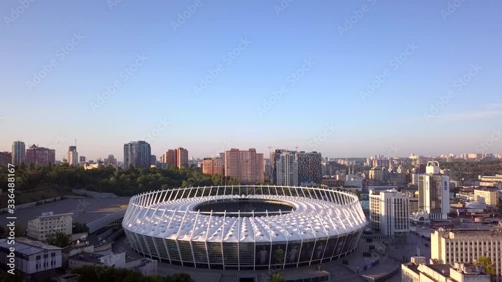 The drone takes off over the football stadium, which is located in the center of the city. Spring, morning. Kiev, Ukraine.