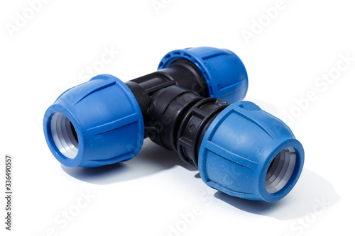 Various plastic fittings for polypropylene pipes on a white background - Image