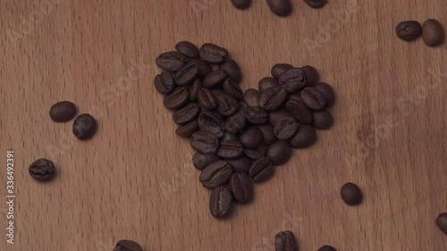 Roasted Coffee Beans. Love for a coffee drink. Heart shaped grains
