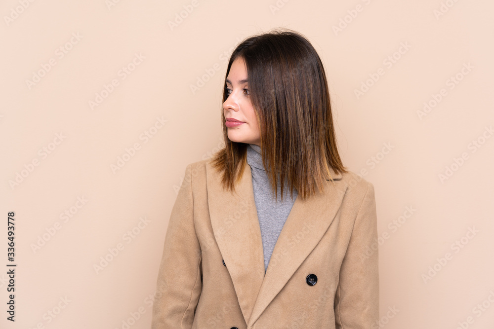Young woman over isolated background looking side