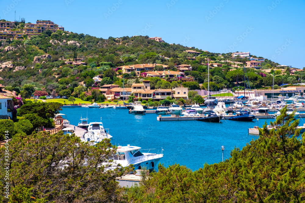 Porto Cervo, Sardinia, Italy - Panoramic view of luxury yacht port, marina and residences of Porto Cervo resort at the Costa Smeralda coast of Tyrrhenian Sea
