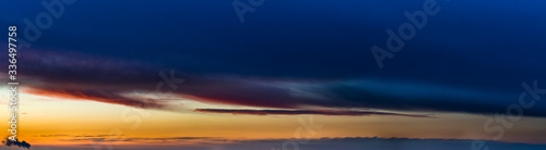 Fantastic dark thunderclouds at sunrise