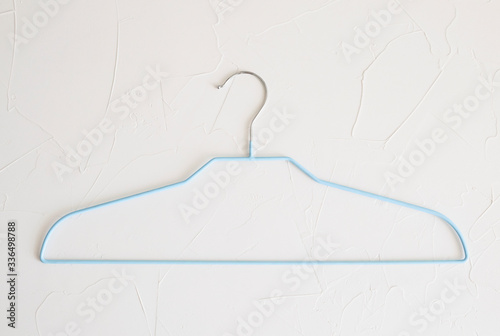 blue thin clothes hanger on white background