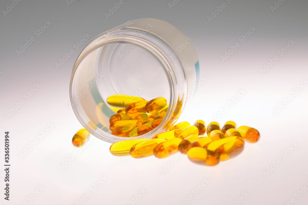 Yellow pills pour out of the can. Close-up. Coronavirus. Saving lives. Healthy lifestyle. Coronavirus. COVID-19. Covid2020 Yellow pills pour out of the can. Close-up. Coronavirus. Saving lives. Healthy lifestyle. Coronavirus. COVID-19. Covid2020