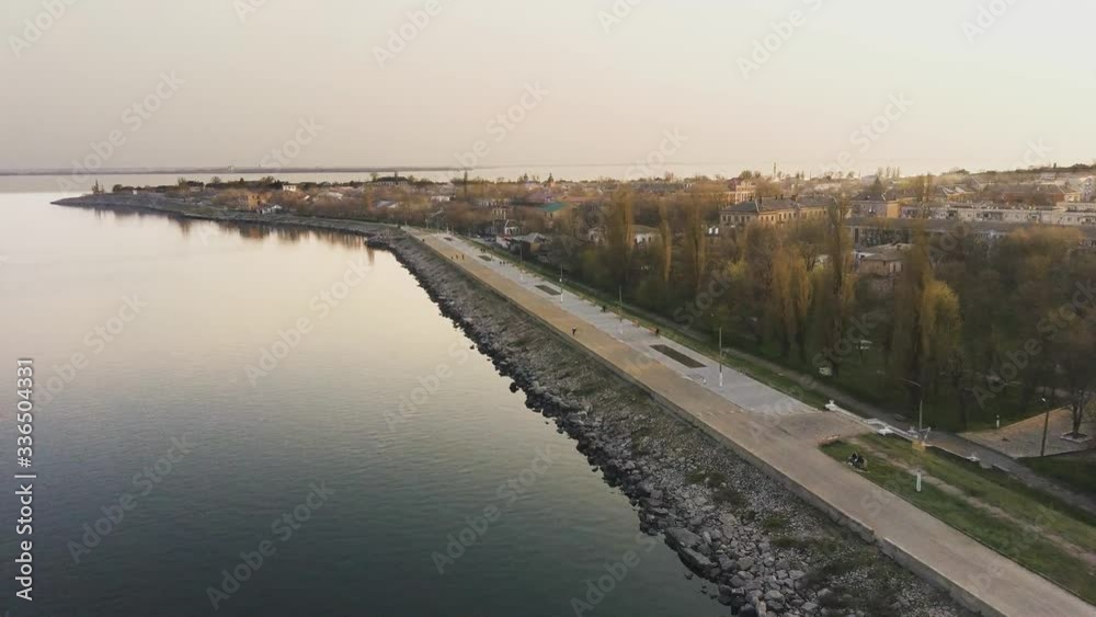 Flight over the Dnieper River. City along the river. City embankment. Sunset. Flight over the Dnieper River. City along the river. City embankment. Sunset.