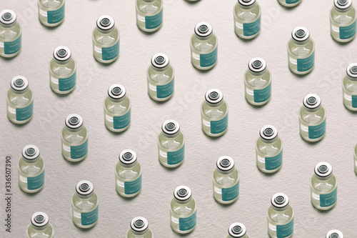 Pattern Of Virus Vaccine Bottles On White Background photo