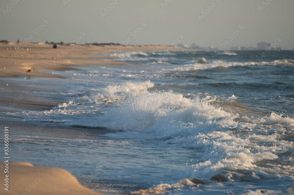 Large ocean waves crash on an empty Atlantic Beach. Large ocean waves crash on an empty Atlantic Beach.