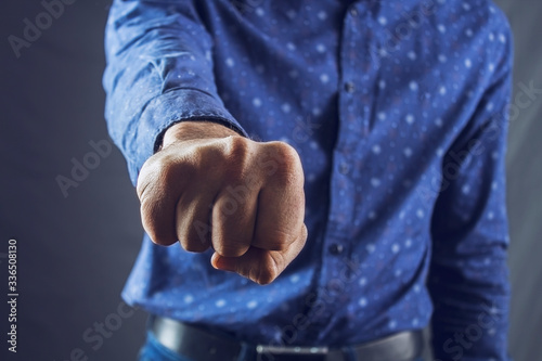 man shows fists © Aram