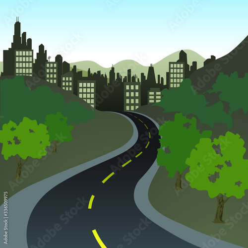 An winding road that leads into a city nested between mountains.