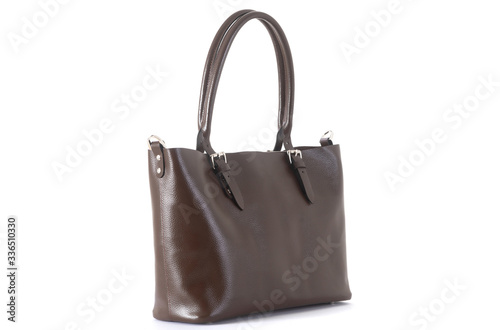 leather female brown bag on the handle sideways on a white background