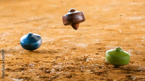 A traditional game called gasing or tops spinning. Gasing is Malaysia popular heritage game for tourist in tourism industries photo