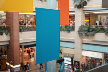 Clean, empty banners hanged inside the shopping mall. Brand promotion, mockup