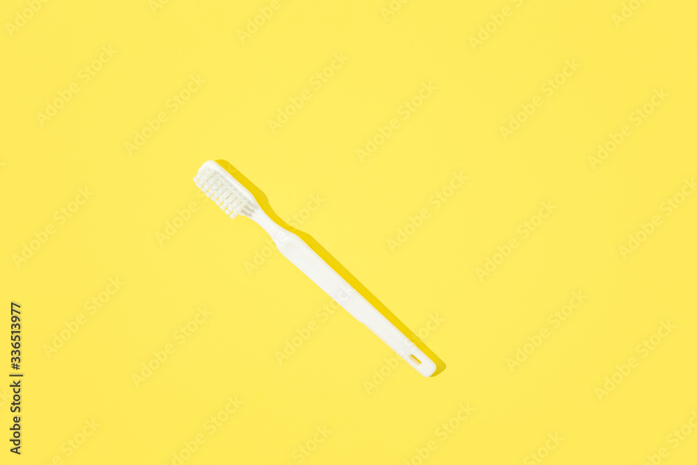 Toothbrush on yellow pastel background. Toothbrush on yellow pastel background.