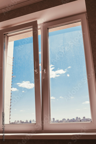 Dirty glass in a double-glazed window - spring cleaning time - the need to wash the windows