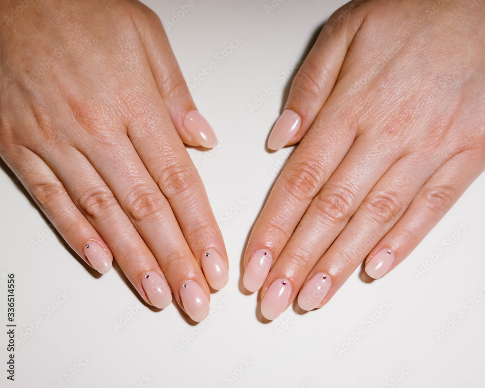 Woman's hand with pink nails