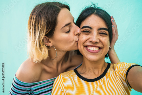 Lovely lesbian couple taking a selfie. photo