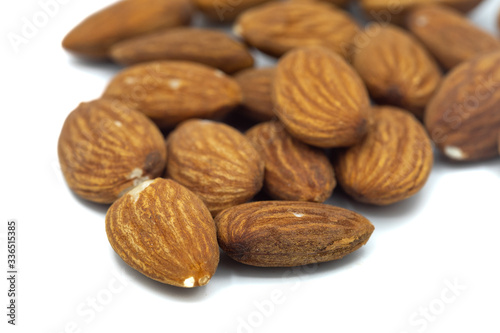 A Close up of almond nuts isolated on a white background
