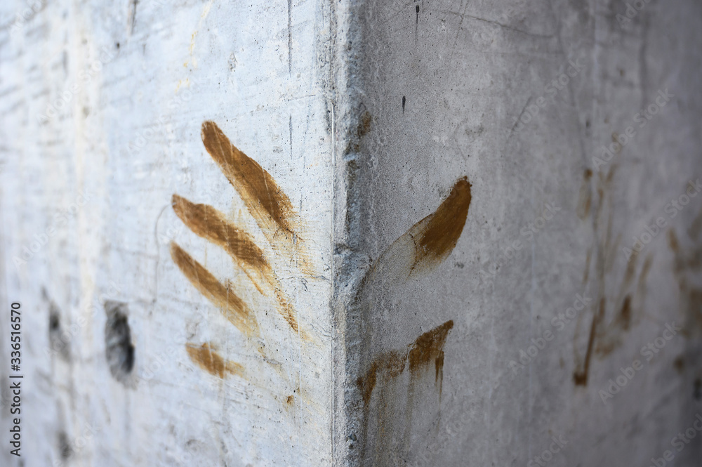 smeared fingerprint on gray concrete wall. construction site. handprint ...