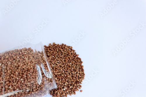 Buckwheat on a white background. Healthy cereals  natural organic food.