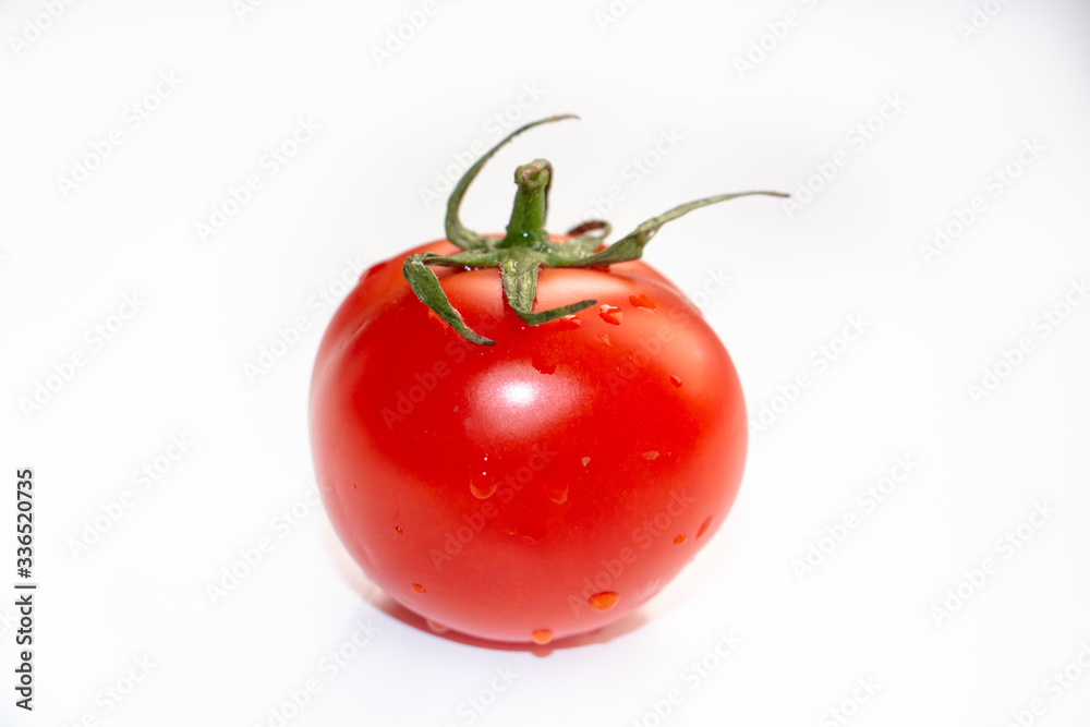 perfect tomato in the center of the frame on a white background perfect tomato in the center of the frame on a white background