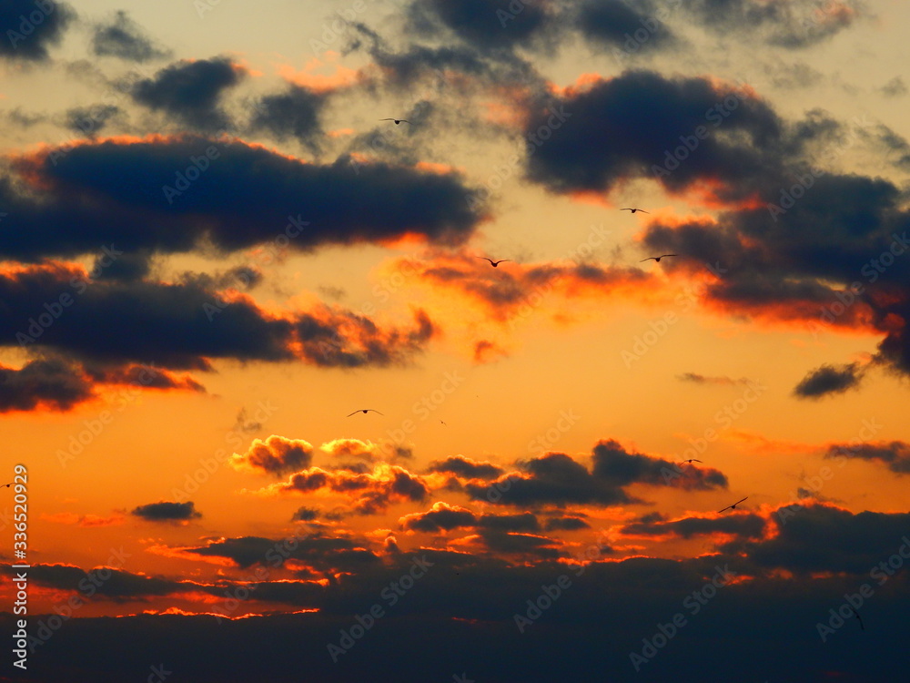 Dark Orange Sunset with Clouds