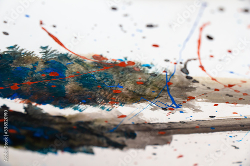 abstraction, random strokes of acrylic paints in black, blue and red