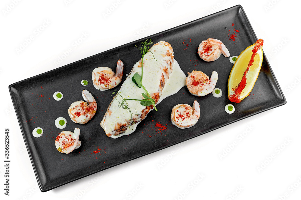 fish baked salmon with sauce on a dark dish fish baked salmon with sauce on a dark dish
