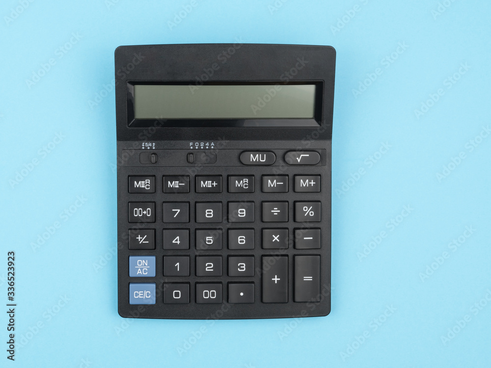 Calculator on a blue background closeup. The concept of calculation. Calculator on a blue background closeup. The concept of calculation.