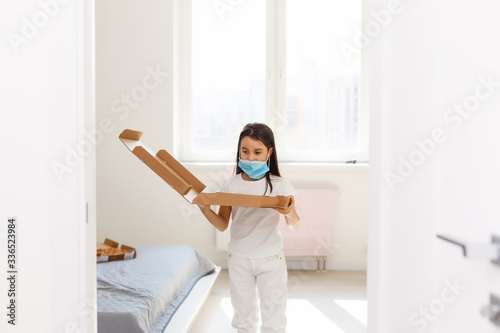 little girl with pizza at hospital