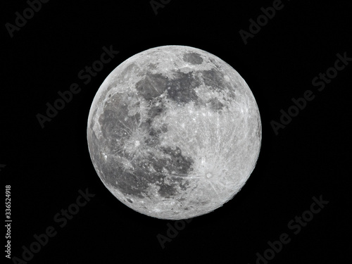 Milan, Italy - April 07 2020: Tonight the moon is at the closest point of 2020 from Earth, view from a quarantined Milan.