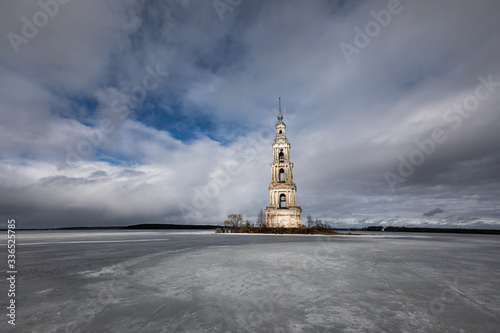 Kalyazin drowned bell tower winter landscape reflection in frozen lake photo