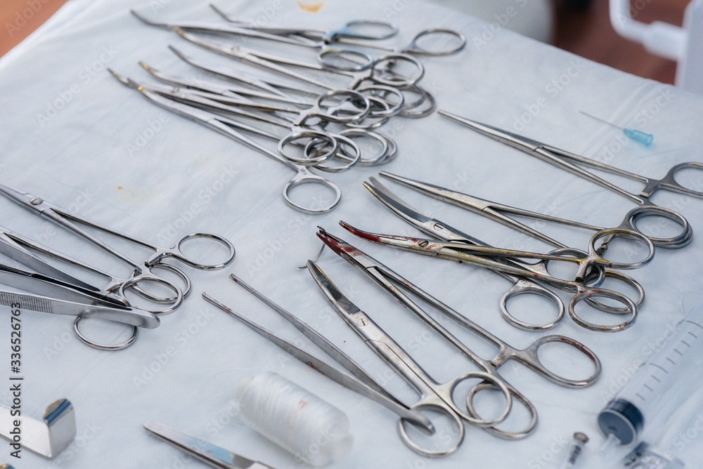 Fototapeta premium Sterile medical instrument close-up on the table before the operation. Medicine and surgery