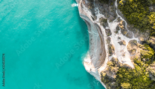 Aerial top view of summer beach and sea.Free space for your decoration and sunny warm day.Corfu island of Greece. 
