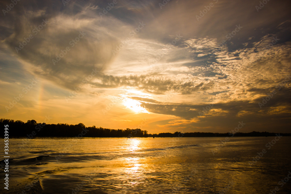Incredible sunset over the river with clouds Incredible sunset over the river with clouds