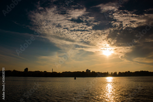 Incredible sunset over the river with clouds