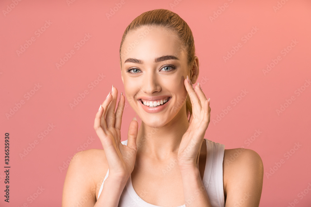 Cheerful Girl Touching Face Smiling To Camera, Pink Studio Background Cheerful Girl Touching Face Smiling To Camera, Pink Studio Background