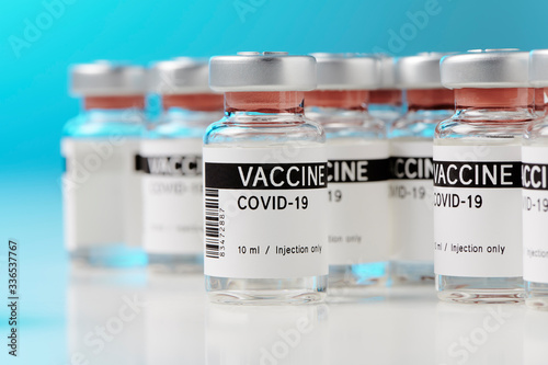 ampoules with Covid-19 vaccine on a laboratory bench. to fight the coronavirus / sars-cov-2 pandemic. photo