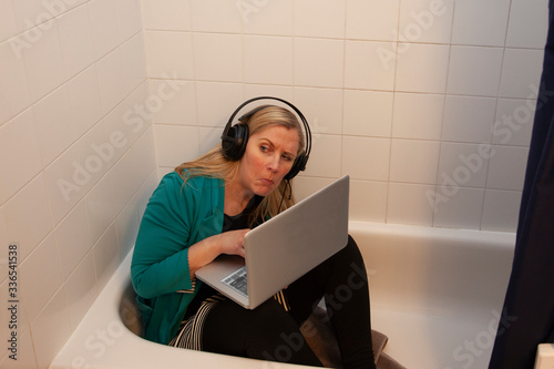 hiding in the tub working from home photo