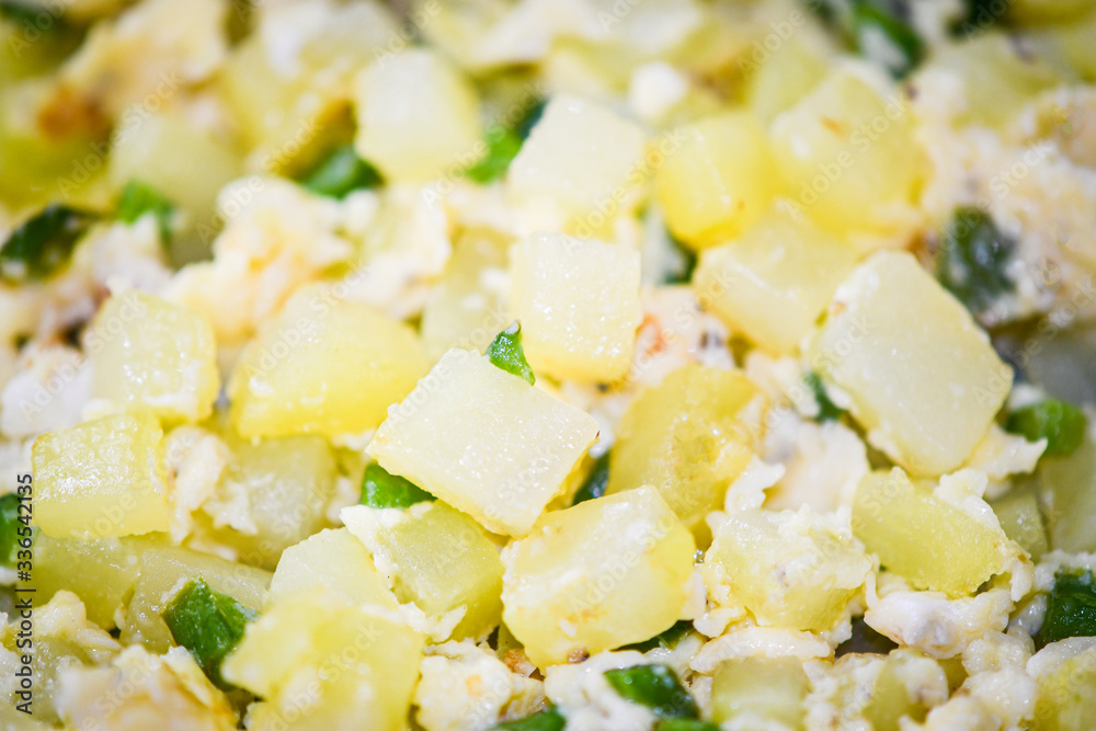 Potatoes with scrambled eggs and jalapeno pepper for breakfast Potatoes with scrambled eggs and jalapeno pepper for breakfast