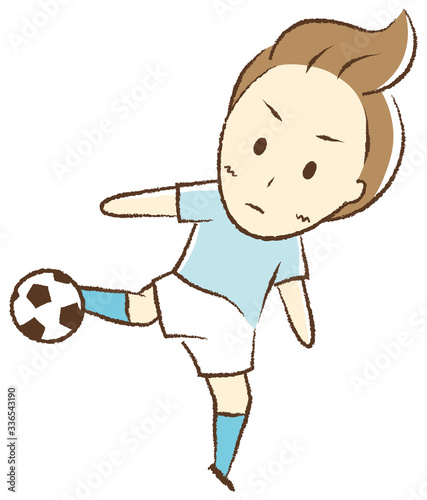 サッカーをする少年　シュート