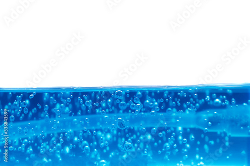 Close up of beautiful curve and nice bubble of drinking water isolated background © Thunder