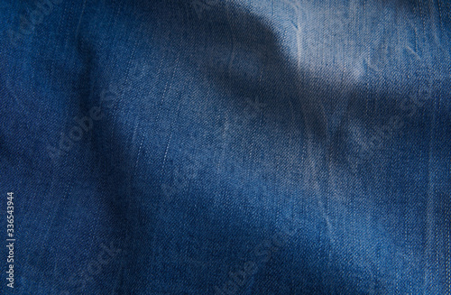blue denim background with scuffed and creases