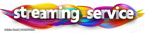 Streaming service sign on brush strokes background.