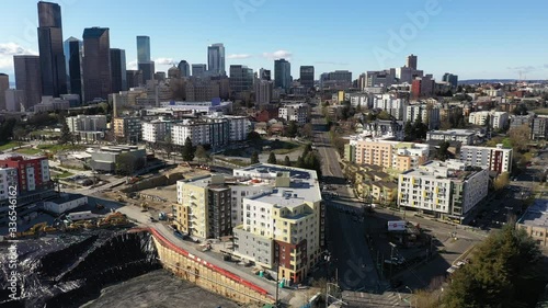 Aerial / drone footage of new development and construction of apartments on hold with empty streets in Yesler Terrace and downtown Seattle, Washington during the COVID-19 pandemic